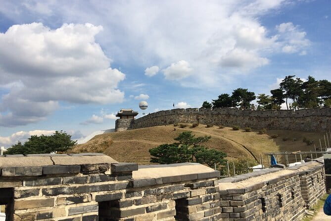 Day Tour of Suwon Hwaseong Fortress Starfield Waujeongsa Temple - Hwaseong Fortress, a 5.74-kilometer Joseon wall