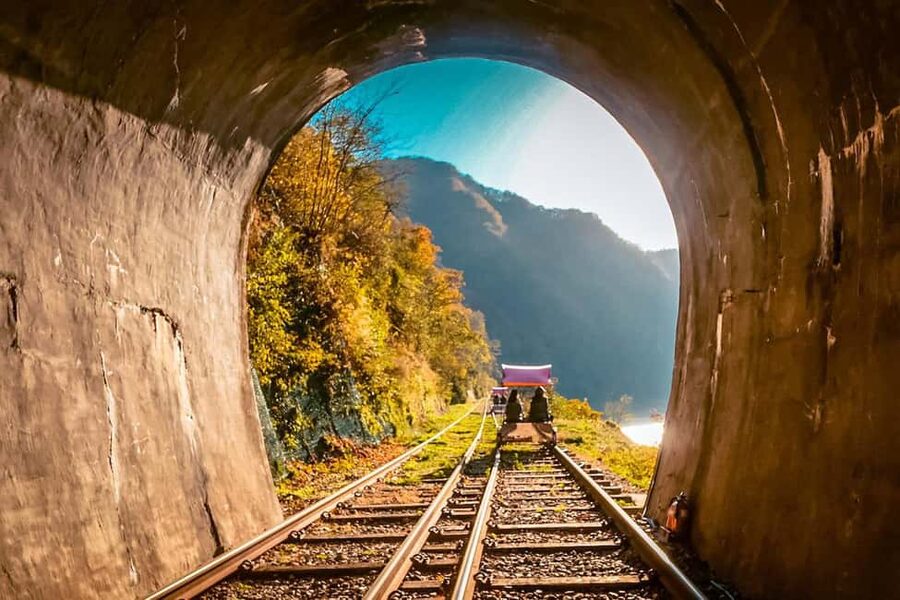 From Seoul: Nami Island, K-drama Garden & Rail Bike Day Tour - Garden of Morning Calm among mountain scenery