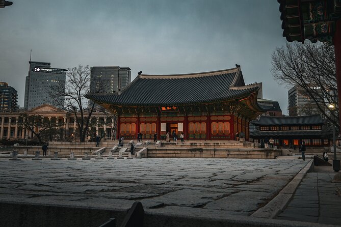 Seoul History Tour: Dark Past & Market Street Flavors - Deoksugung Palace shows a royal court in transition