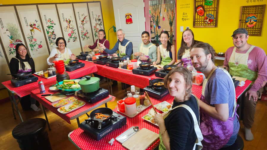 Seoul: Korean Cooking Class at a Local Home and Market Tour - Four dishes, four different Korean cooking lessons