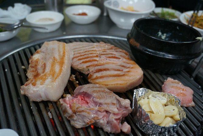Seoul Night "Private Tour"(Korean BBQ, N-Tower, Seoul Fortress, Local Market) - Cheonggyecheon Stream and the city at street level